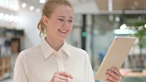 Young Woman Using Tablet for Video Call