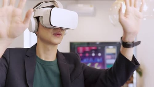 Young Adult Using VR Headset in Office