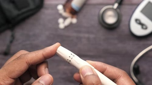 Top View of Man Hand Measuring Diabetic on Table