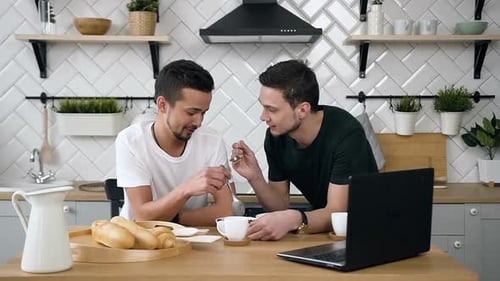 Affectionate Couple Sharing Food in Kitchen