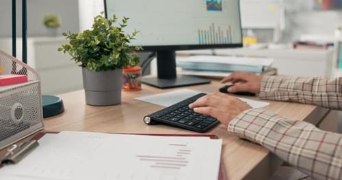 Closeup of a Black Keyboard From a Computer Standing on a Wooden Desk on It a Working Woman Young