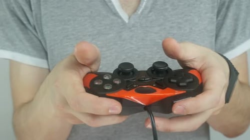 Adult Playing Video Game with Controller Close Up