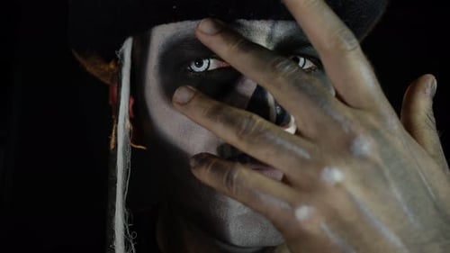 Man with Skeleton Face Paint and Pirate Hat