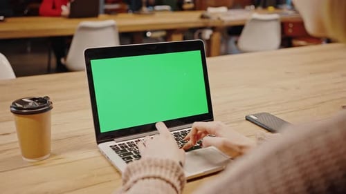 Close Up Shot of Laptop with Green Chroma Key Screen Unrecognizable Woman Student Typing Online at