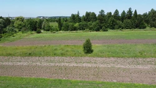 Aerial drone view of a flying over the rural agricultural landscape.