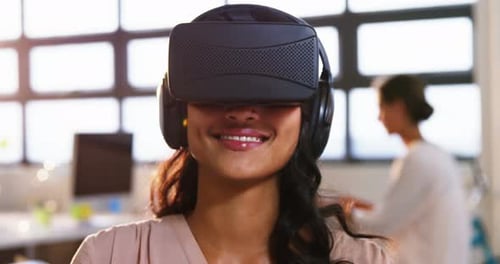 Woman Using VR Headset in Bright Office