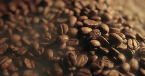 Fragrant Roasted Coffee Beans and Aromatic Hot Smoke Close Up