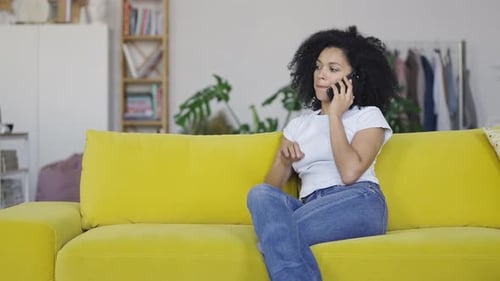 Woman Relaxing at Home on Phone