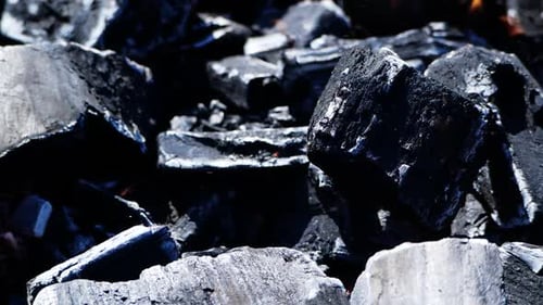 Burning Charcoal Embers and Flames Close Up