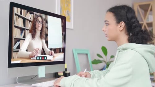 African Teen School Girl Remote Learning Online Class with Web Teacher