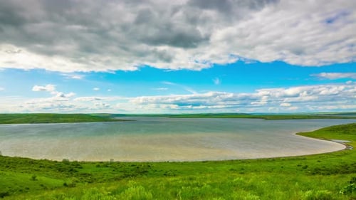 White Fluffy Clouds over the Lake