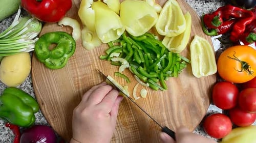 The Cook Cuts Pepper