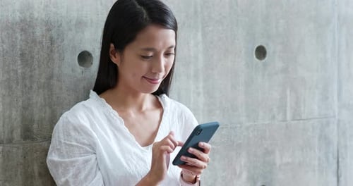 Woman use of cellphone in campus