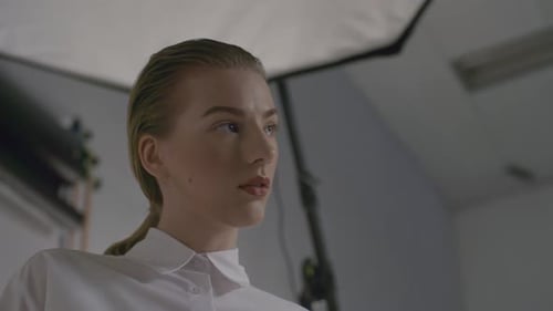 Blonde Woman Posing in White Shirt in Studio
