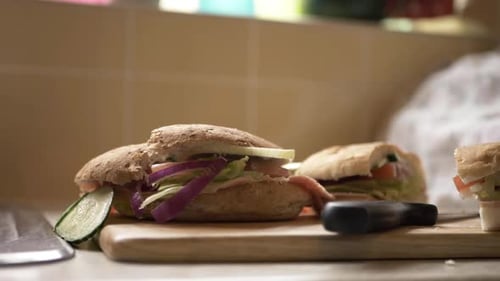 Delicious Sandwiches on Cutting Board in Kitchen