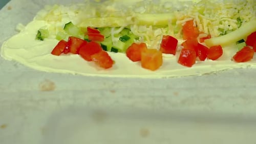 Chef Preparing Food with Cheese and Vegetables