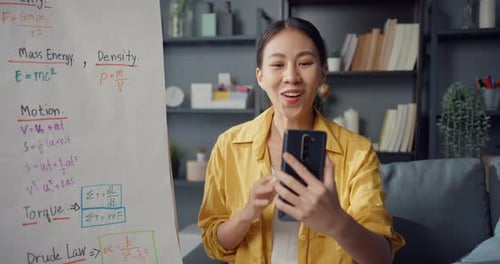Asia lady teacher video conference calling on smartphone talk by webcam learn teach in online.