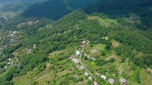 Aerial Drone View of a Village in a Mountain Forest.