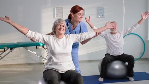 Senior Patients Exercising With Physical Therapist