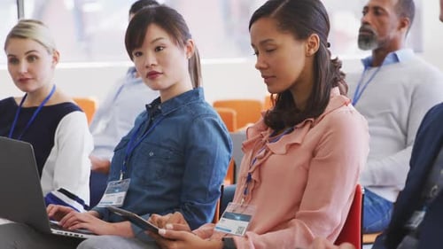 Business people attending to a meeting in conference room