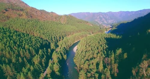 Low Altitude Flight Over Fresh Fast Mountain River with Rocks at Sunny Summer Morning.