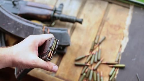 Cartridges Charging. Close-Up View. Shooting