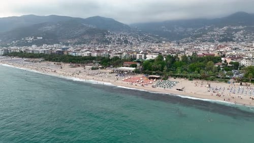 Cloudy summer beach aerial view 4 K Turkey Alanya
