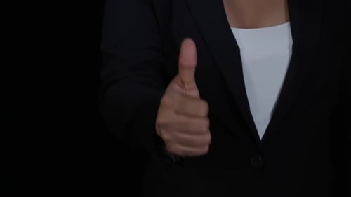 Hand Giving Thumbs Up Wearing Business Attire