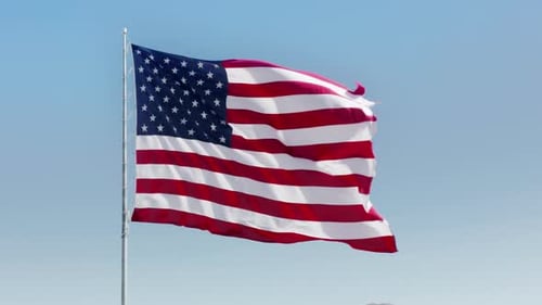 Waving American Flag Against a Blue Sky