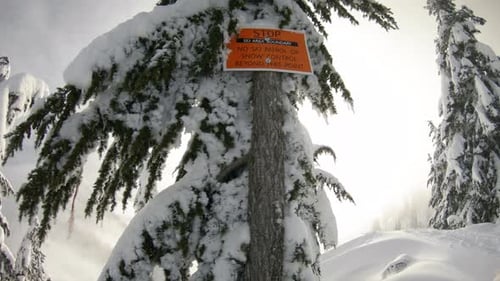 Pan From Ski Boundary Sign To Snowy Mountain Peaks In Dreamy Backcountry