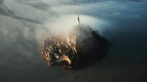 Drone Flying High Around Amazing Mont Saint Michel Island Castle Fortress Covered with Massive