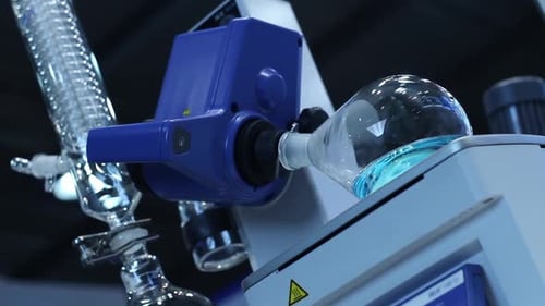 Lab Equipment Rotating Flask with Blue Liquid