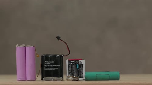 Batteries on a Wooden Table Top Still Life