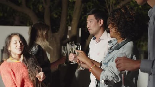 Friends Celebrating with Champagne in Urban Setting