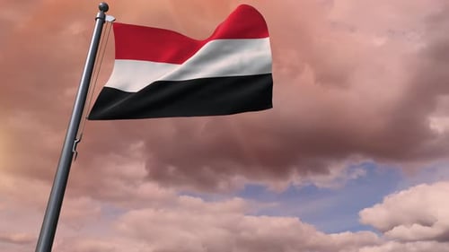 Waving Flag of Yemen against a Cloudy Sky