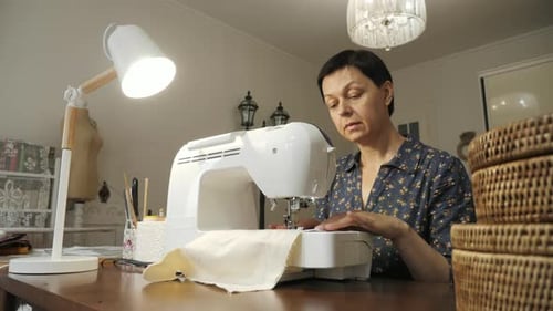 Woman working with the sewing machine