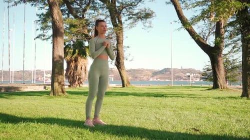 Fitness Woman 20s in Sports Wear Doing Lunges and Stretching Legs on Summer Park
