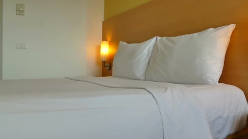 Clean Bed with White Linens and Pillows