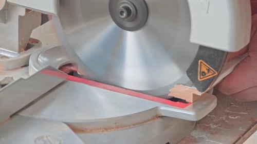 Carpenter Using Circular Saw for Cutting Wooden Boards
