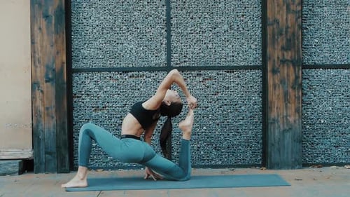 Young beautiful woman practicing yoga. Wellness concept. Calmness and relax, woman happiness. Toned