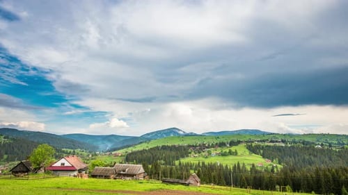 Time Lapse of Blue Sky with Clouds Over Mountain