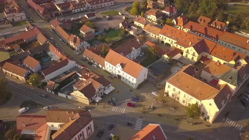 Aerial view of small old european town with red tiled roofs of small houses and narrow streets.