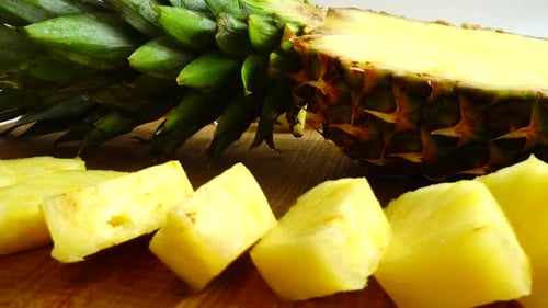 Delicious Pineapple Chunks on Wooden Cutting Board