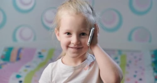Smiling Child Using Smartphone for Communication