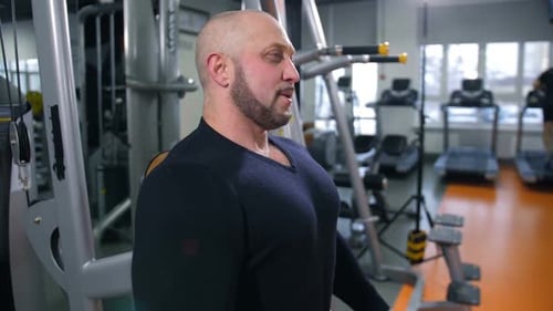 Adult Man Breathes Heavily After Training in the Gym Slow Mo