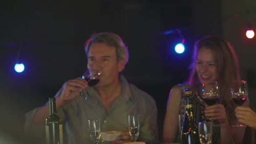 Friends Having Drinks at Evening Celebration
