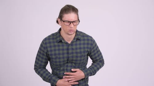 Man clutching stomach in pain