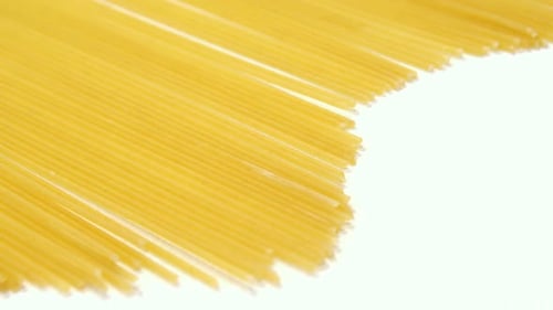 Uncooked Spaghetti Close Up on White Background