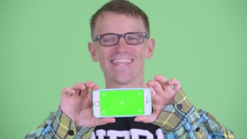 Person Displaying Smartphone with Green Screen