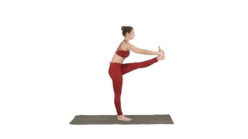 Young Adult Woman Demonstrates Balancing Yoga Pose